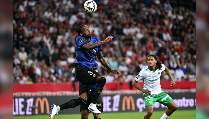 Nices Dutch midfielder #08 Pablo Rosario heads the ball during the French L1 football match between OGC Nice and AS Saint-Etienne at the Allianz Rivera stadium in Nice, south-eastern France, on September 20, 2024. — AFP