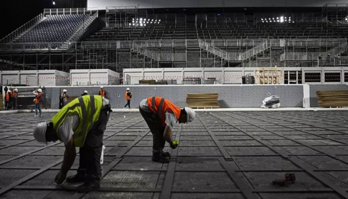 Workers are dismantling the pool at the Defense Arena west of Paris ahead of its re-location. — AFP/File