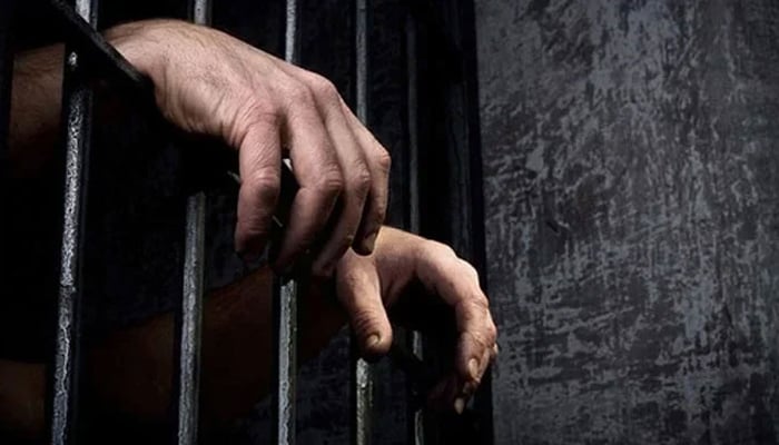 This representational image shows the hands of an incarcerated person. — AFP/File