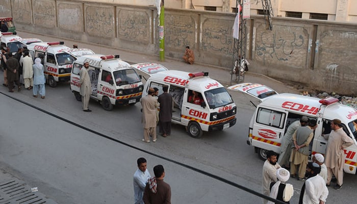 Edhi ambulances can be seen parked on a road in Karachi. — AFP/File