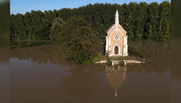 An aerial view taken on September 21, 2024, shows the Zichy Chapel close to Lorev, about 70 kilometres south of the Hungarian capital Budapest, surrounded by the floodwater of the Danube River. — AFP