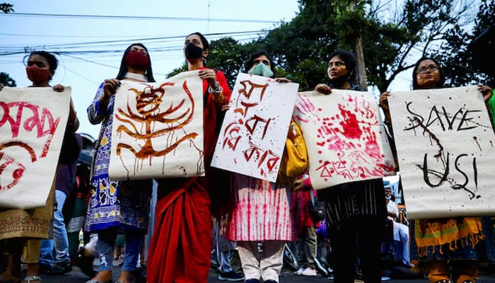 Bangladeshi writers and activists take part in a human chain demanding to stop communal violence and justice for the violence against Hindu communities during Durga Puja festival in Dhaka, Bangladesh, October 19, 2021. REUTERS