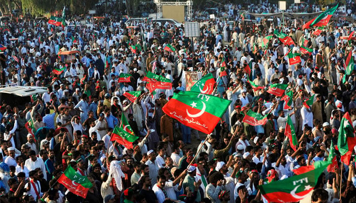 Supporters of jailed former Pakistani Prime Minister Imran Khans party, the Pakistan Tehreek-e-Insaf (PTI), wave party flags during a rally in Islamabad, Pakistan September 8, 2024. — Reuters