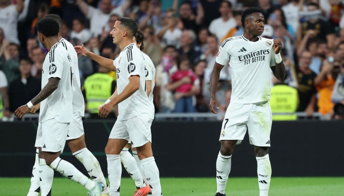 Vinicius Junior (right) celebrates scoring his Real Madrids third goal against Espanyol. — AFP/file