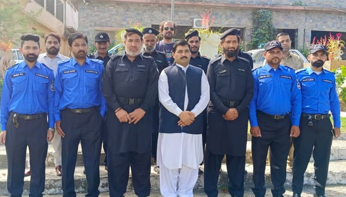 Deputy Commissioner Mansehra Mazhar Muzaffar Awan along with tehsil municipal staff seen in this image released on September 21, 2024. — Facebook/@TMAMansehra