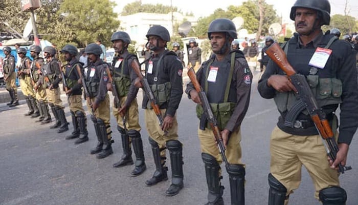 A representational image showing police personnel standing guard in Karachi. — AFP/File