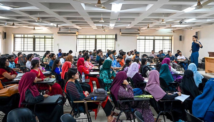 Students of the Dhaka University attend a class in the capital on September 22, 2024. — AFP