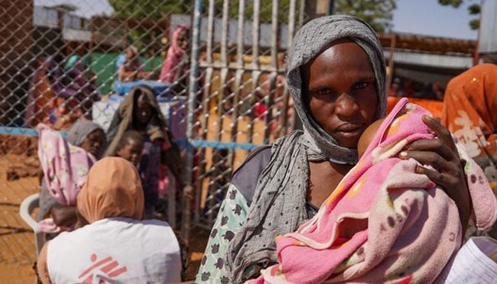 A handout photograph, shot in January 2024, shows a woman and baby at the Zamzam displacement camp, close to El Fasher in North Darfur, Sudan. — Reuters