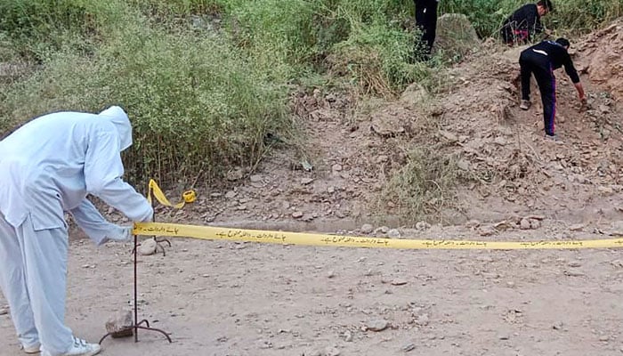 Security personnel examine the site of a bomb explosion, at Malam Jabba in the Swat district of Khyber Pakhtunkhwa province on September 22, 2024. — AFP