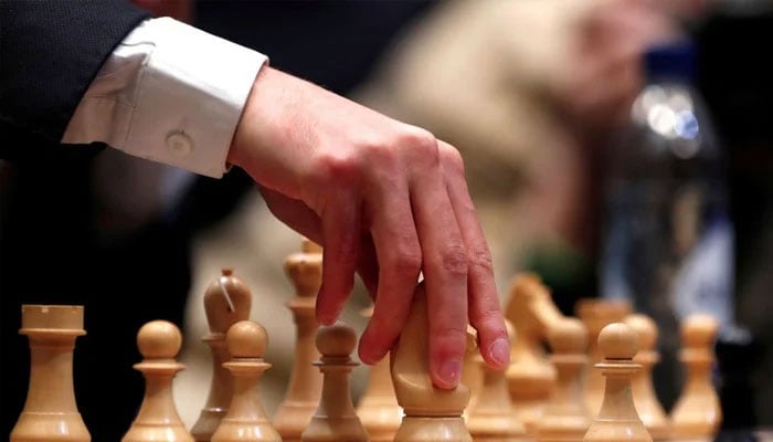 USAs Fabiano Caruana plays a move during round 12 of the World Chess Championship Final.— Reuters/file