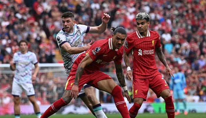 Liverpools Uruguayan striker Darwin Nunez and Colombian midfielder Luis Diaz challenge Bournemouths Scottish midfielder Ryan Christie during the English Premier League football match at Anfield in Liverpool, northwest England, on Saturday.— AFP/file