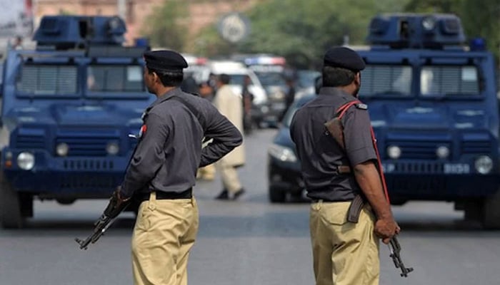 A representational image showing Karachi police personnel standing guard. — AFP/File