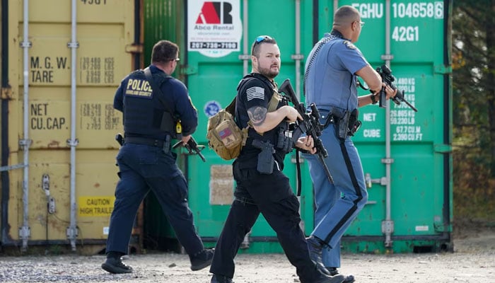 Members of law enforcement search a farm, as the search for the suspect in the deadly mass shootings in Lewiston continues, in Lisbon Falls, Maine, US on October 27, 2023. — Reuters