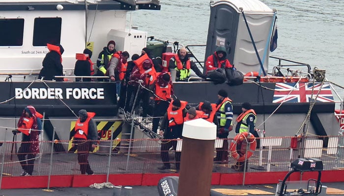 People, believed to be migrants, disembark from a British Border Force vessel as they arrive at Port of Dover, Dover, Britain, January 17, 2024. — Reuters