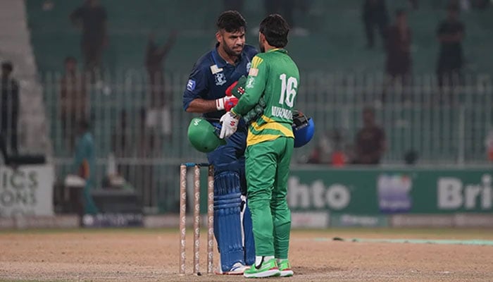 Panthers wicketkeeper-cum-batsman Usman Khan shakes hands with Markhors skipper Mohammad Rizwan after Panthers 7-wicket victory in Champions One-Day Cup Qualifier 1 at Faisalabads Iqbal Stadium on September 24, 2024. — PCB