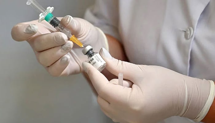 A representational image of a nurse preparing a vaccine to be administered to a patient. — AFP/File