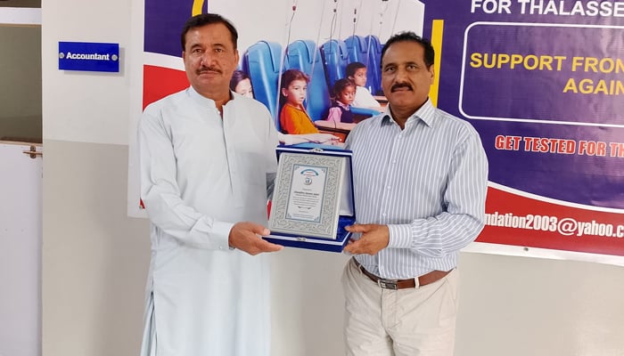 Frontier Foundation Chairman Sahibzada Muhammad Haleem is giving shield to Chairman of Pakistan Union Norway, Chaudhry Qamar Iqbal seen in this image released on September 19, 2024. — Facebook/@frontier.org.pk