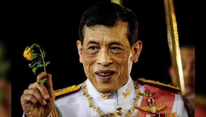 Thailands King Maha Vajiralongkorn greets royalist supporters after a Buddhist ceremony for the late king Chulalongkorn in Bangkok on October 23, 2020. — AFP