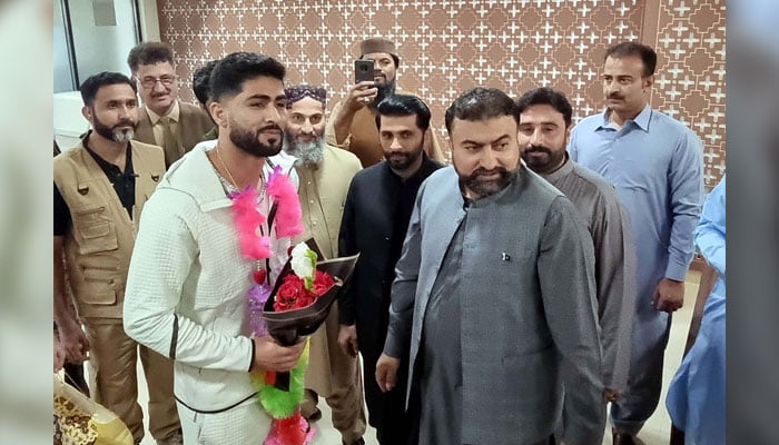 Balochistan Chief Minister, Mir Sarfraz Bugti (right) welcomed Mixed Martial Arts (MMA) Fighter, Shahzaib Rind (left) after he won the Karate Combat World Championship title in Singapore, on his arrival in Quetta on September 24, 2024. — PPI