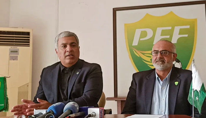 Pakistan Football Federation Chairman  Haroon Malik (L) addresses media in Lahore - PFF/File