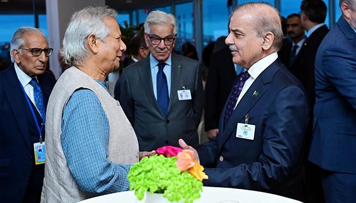 Bangladesh Interim Governments Chief Advisor Dr Muhammad Yunus (left) receives PM Shehbaz Sharif at the reception to commemorate the 50th anniversary of Bangladeshs UN membership in New York on September 25, 2024. — PID