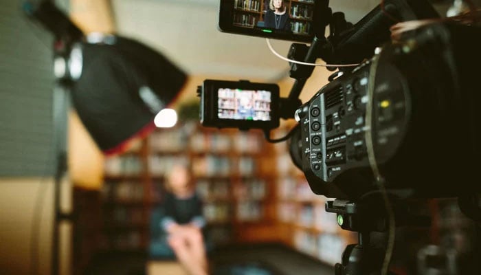 This representational image shows a reporter is recording his news report. — Unsplash/File