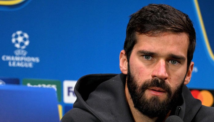 Liverpools Brazilian goalkeeper Alisson Becker attends a press conference on the eve of the UEFA Champions League football match between AC Milan and Liverpool in Milan on September 16, 2024. — AFP