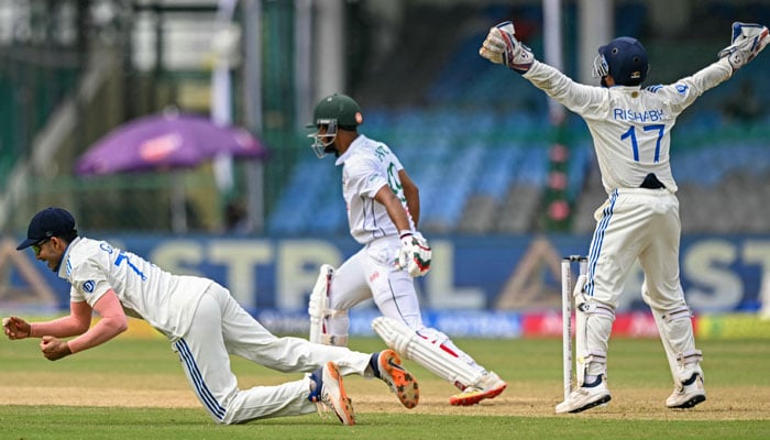 Indias players successfully appeal for leg before wicket (LBW) against Bangladeshs captain Najmul Hossain Shanto (C) during the first day of the second Test cricket match between India and Bangladesh in Kanpur on September 27, 2024. — AFP