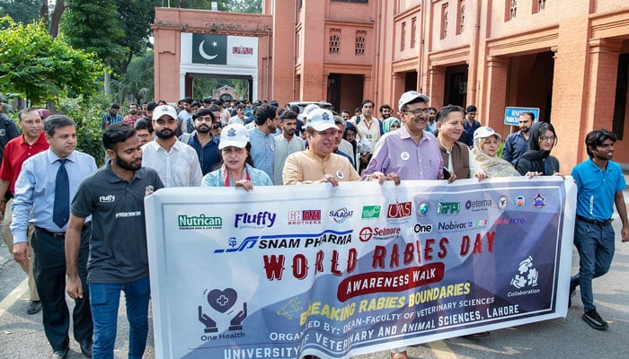 UVAS Vice Chancellor Prof Dr M Younus (from 4th left)seen in an awareness walk and vaccination camp to mark World Rabies Day with the theme of “Breaking Rabies Boundaries” to create awareness among the public against rabies at City Campus on September 27, 2024. — Facebook/UVAS