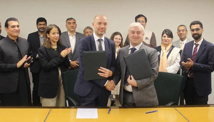 Denmarks Ambassador Jakob Linulf (left) shakes hands with AKF CEO Akhtar Iqbal after signing the SCRIP agreement in Islamabad on September 27, 2024. — PR