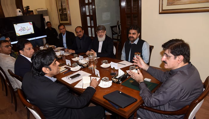 Chief Minister Sindh Syed Murad Ali Shah is talking to Chief Secretary Sindh Asif Haider Shah in a meeting on the Malir Expressway project at Chief Minister House image released on September 27, 2024.— Facebook/@SindhCMHouse