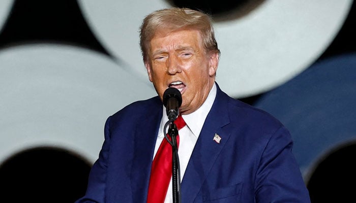 Former US President and Republican presidential candidate Donald Trump speaks during a campaign event in Walker, Michigan, on September 27, 2024. — AFP