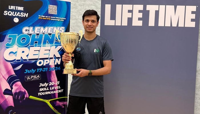 Pakistani squash player Asim Khan seen with the trophy after winning the Jones Creek Open Squash Championship.— Provided by reporter/file