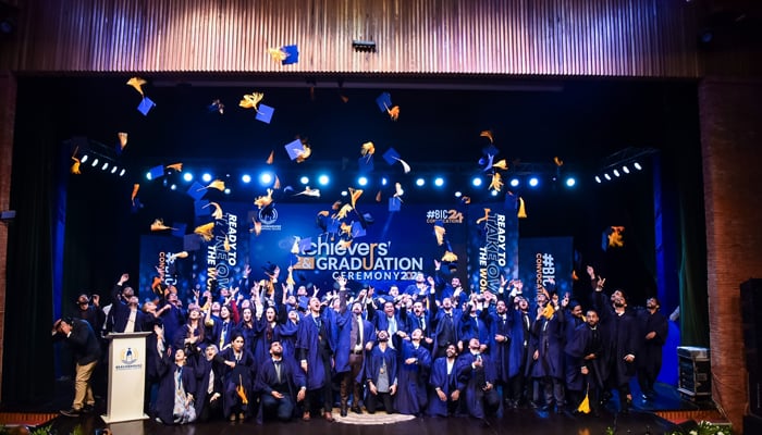 Beacon House graduates toss their caps in the air at Convocation on September 29, 2024. — Facebook/@bicbeaconhouse