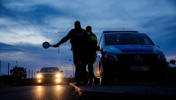 Officers of the German Federal Police stop a car near Forst, eastern Germany, during a patrol near the border with Poland. — AFP/file