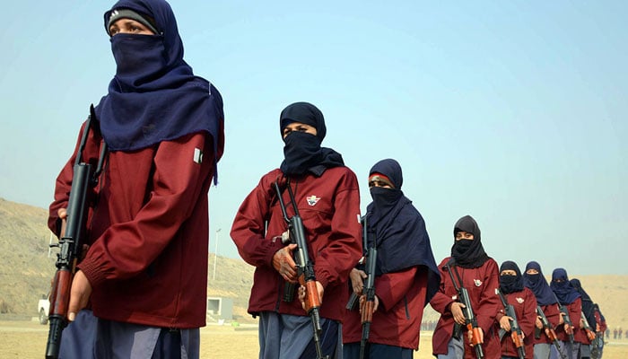 A representational image showing female police commandos wielding their weapons during an exercise at a police training centre in Nowshera, KP. — AFP/File