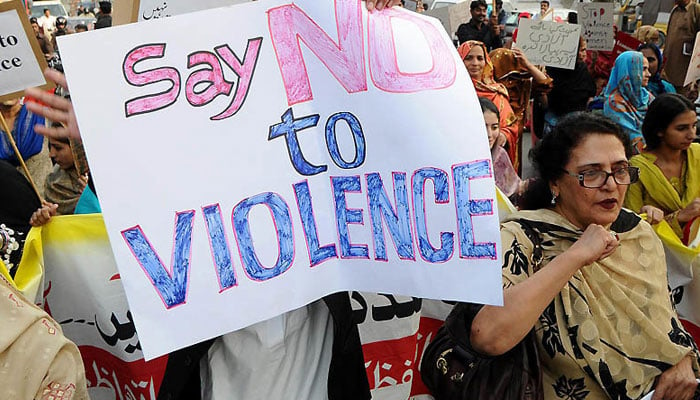 Women can be seen protesting against violence in Pakistan. — AFP/File