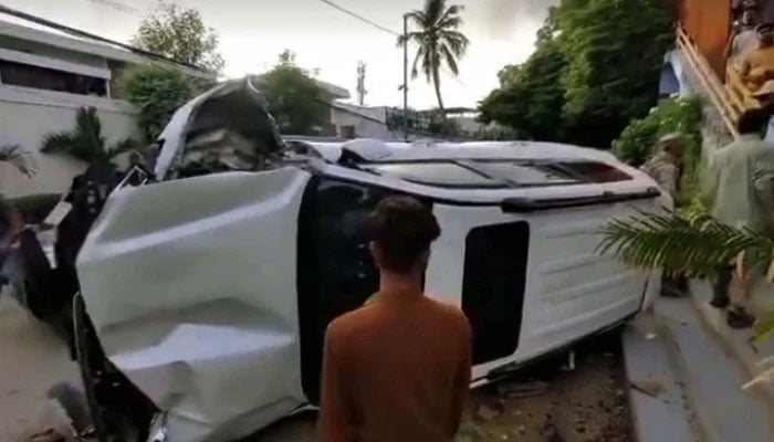 A vehicle lies upside down after an accident near Karsaz in Karachi on August 19, 2024. — PPI