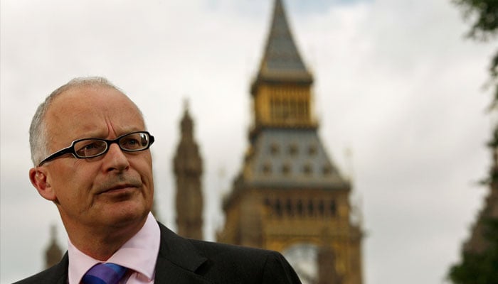 British lawyer Phil Shiner of Public Interest Lawyers pauses between television interviews outside the Palace of Westminter in London, June 2007. — Reuters