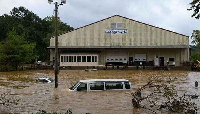 Heavy rains from Hurricane Helene caused record flooding and damage in Asheville, North Carolina, on Monday. — AFP