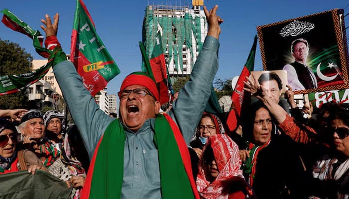 PTI supporters chant slogans during a protest outside the provincial election commission office in Karachi, February 17, 2024. — Reuters