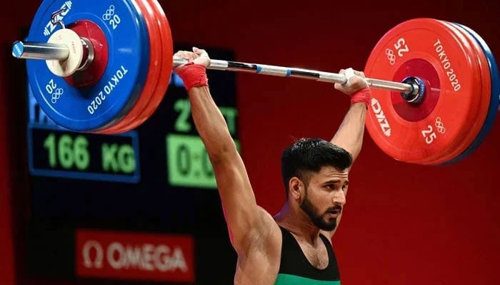 Pakistans Talha Talib is seen lifting weights as part of  a competition related to Tokyo Olympics 2020. — Reuters/file