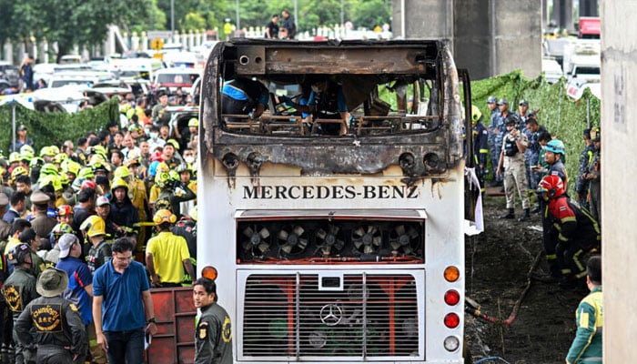 The bus affected by a devastating blaze seen on a highway in a northern Bangkok suburb. — AFP/file