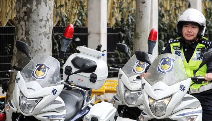 Chinese police officer seen on a police bike.— AFP/file