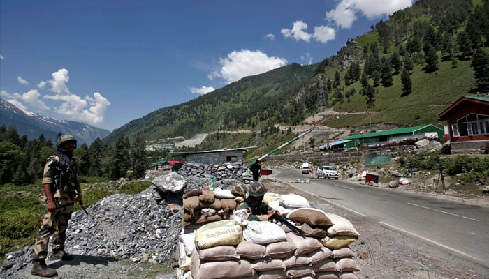 Indias Border Security Force (BSF) soldiers stand guard at a checkpoint along a highway leading to Ladakh, at Gagangeer in Kashmirs Ganderbal district June 17, 2020. — Reuters