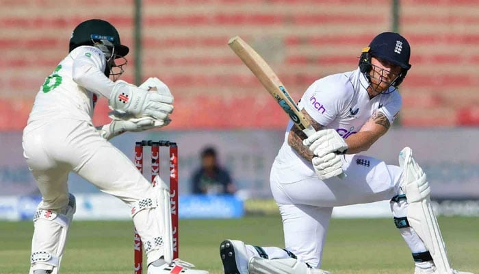 England’s captain Ben Stokes (R) plays a shot during the fourth day of third Test match between Pakistan and England at the National Stadium in Karachi. — AFP/File