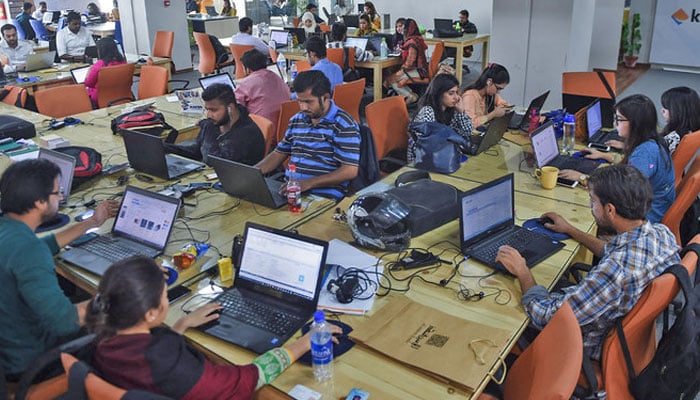 A representational image showing employees of online marketplace company in Karachi. — AFP/File