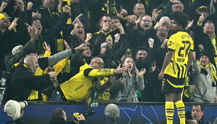 Borussia Dortmund forward Karim Adeyemi and crowd celebrating.— AFP/file