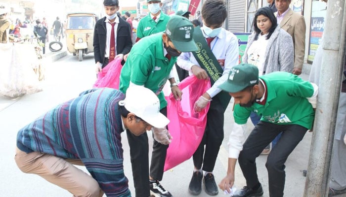 Students and the activists of the Pak Mission Society taking part in the clean-up drive in Lahore on Oct 2, 2024. — Pak Mission Society website