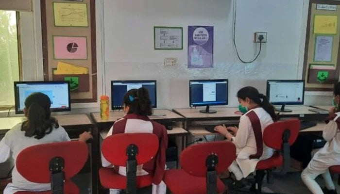 This undated photo shows school students learning IT skills at a computer lab in a school in Islamabad. — APP/File